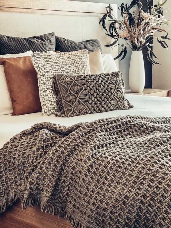 Cushions and a knitted throw sourced by Ruby International